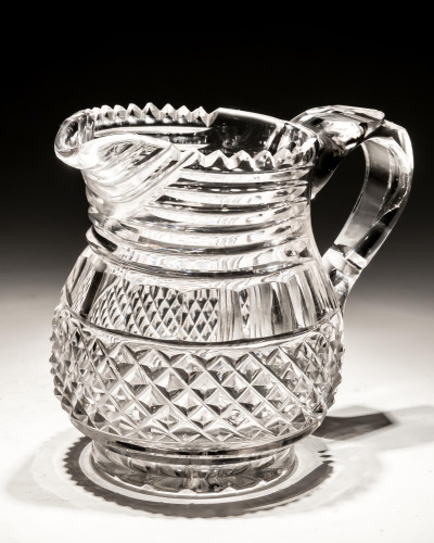 A CUT GLASS REGENCY JUG