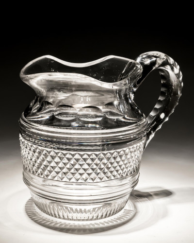 AN IRISH CUT GLASS JUG