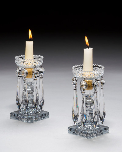 A PAIR OF REGENCY CANDLESTICKS