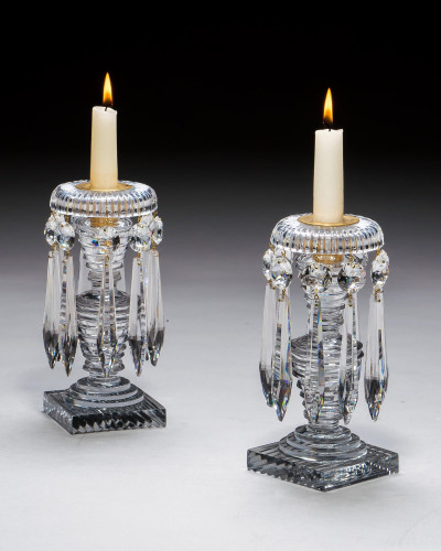 A PAIR OF STEP CUT REGENCY CANDLESTICKS