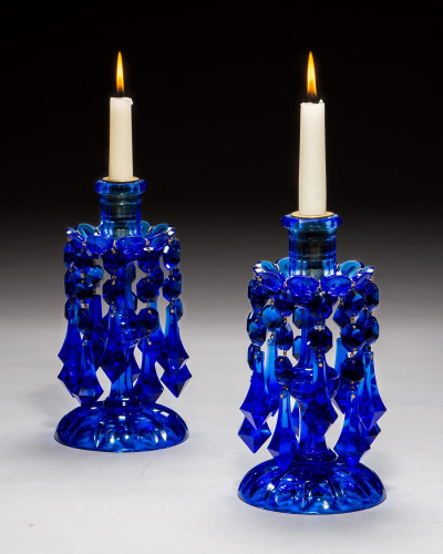A STRIKING PAIR OF COBALT BLUE CUT GLASS CANDLESTICKS