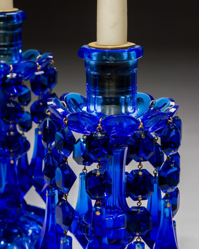 A STRIKING PAIR OF COBALT BLUE CUT GLASS CANDLESTICKS