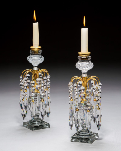 A PAIR OF ORMOLU MOUNTED CANDLESTICKS