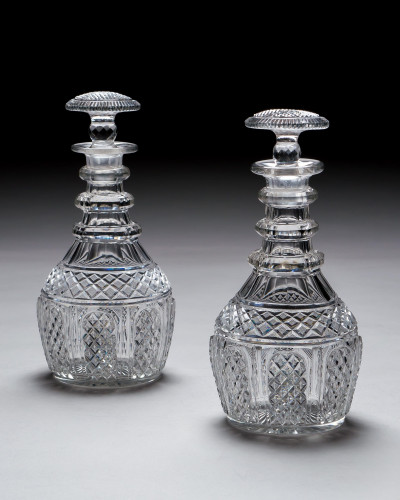 A PAIR OF ELABORATELY CUT REGENCY DECANTERS