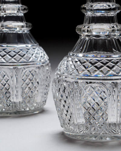 A PAIR OF ELABORATELY CUT REGENCY DECANTERS