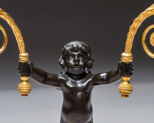 A PAIR OF REGENCY ORMOLU & BRONZE BOY CANDELABRA