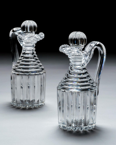 A PAIR OF PILLAR CUT REGENCY CLARET JUGS