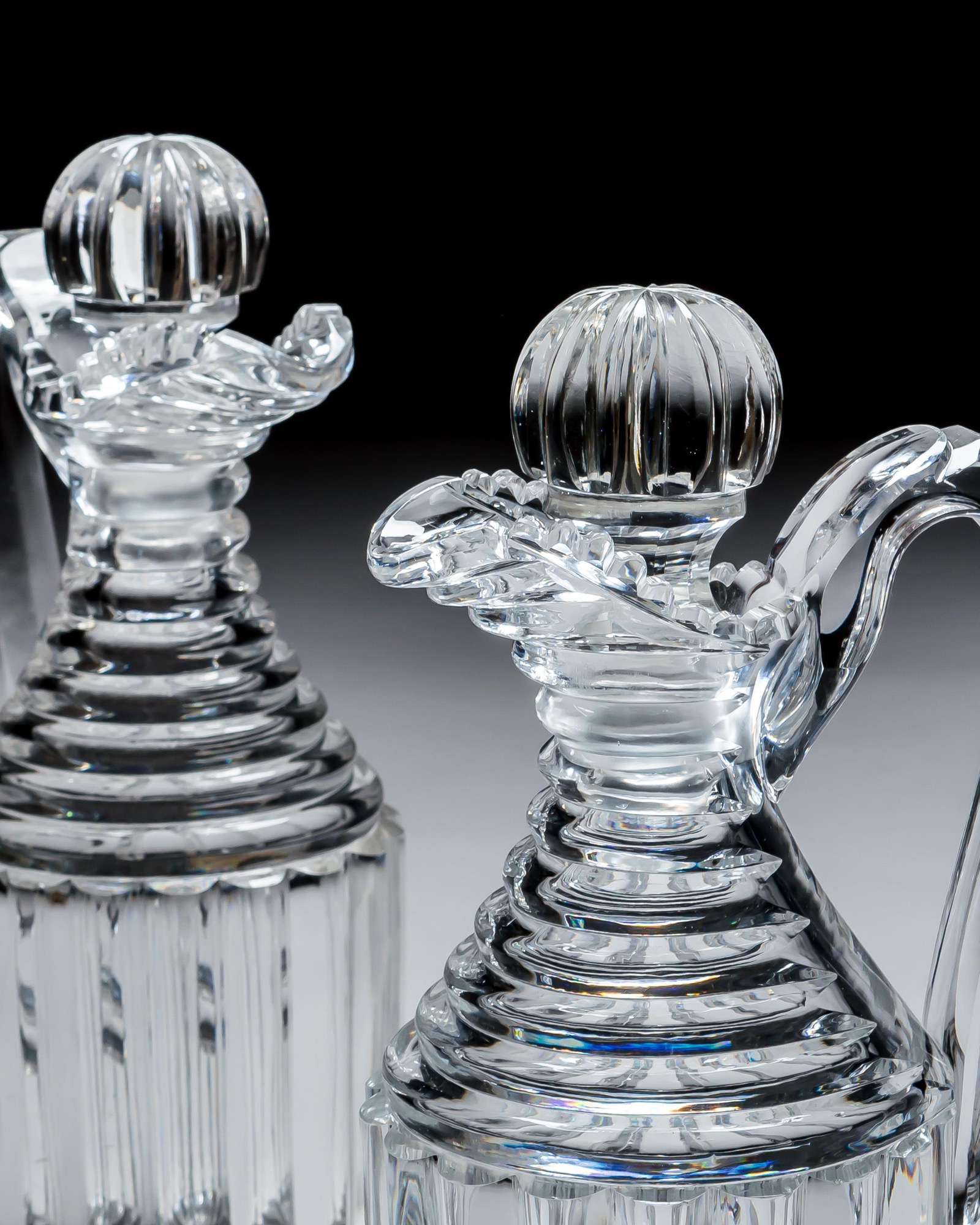 A PAIR OF PILLAR CUT REGENCY CLARET JUGS