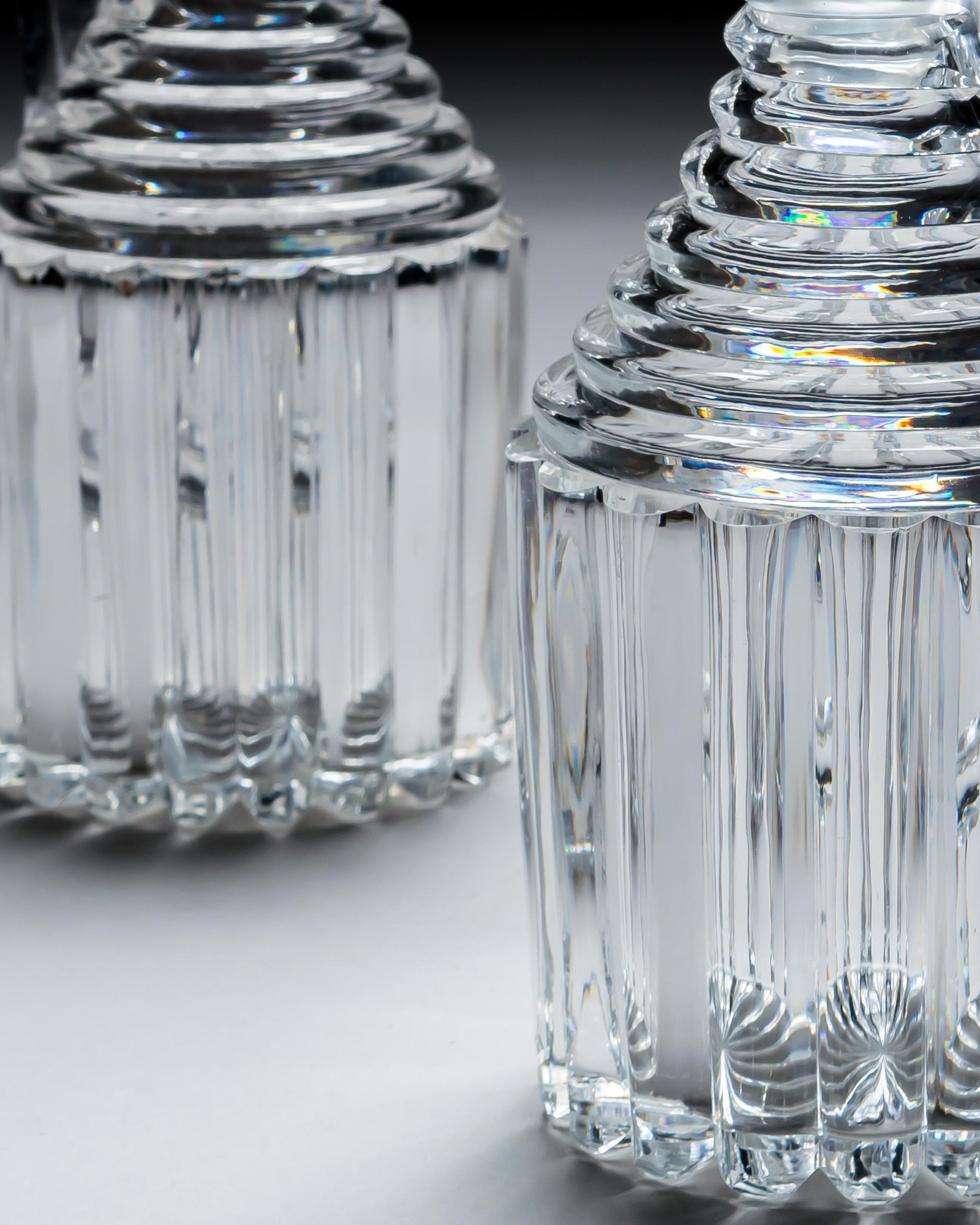 A PAIR OF PILLAR CUT REGENCY CLARET JUGS