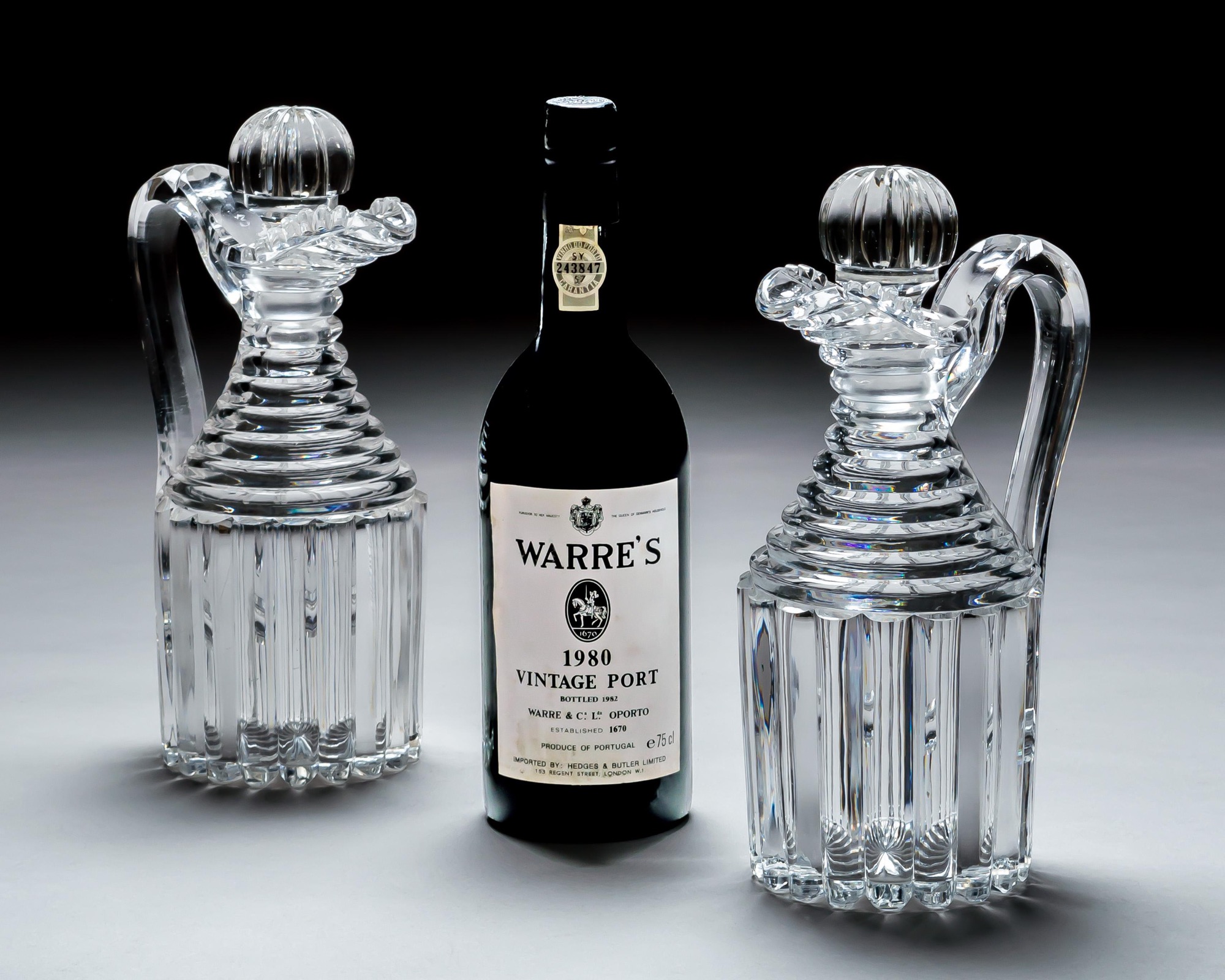 A PAIR OF PILLAR CUT REGENCY CLARET JUGS