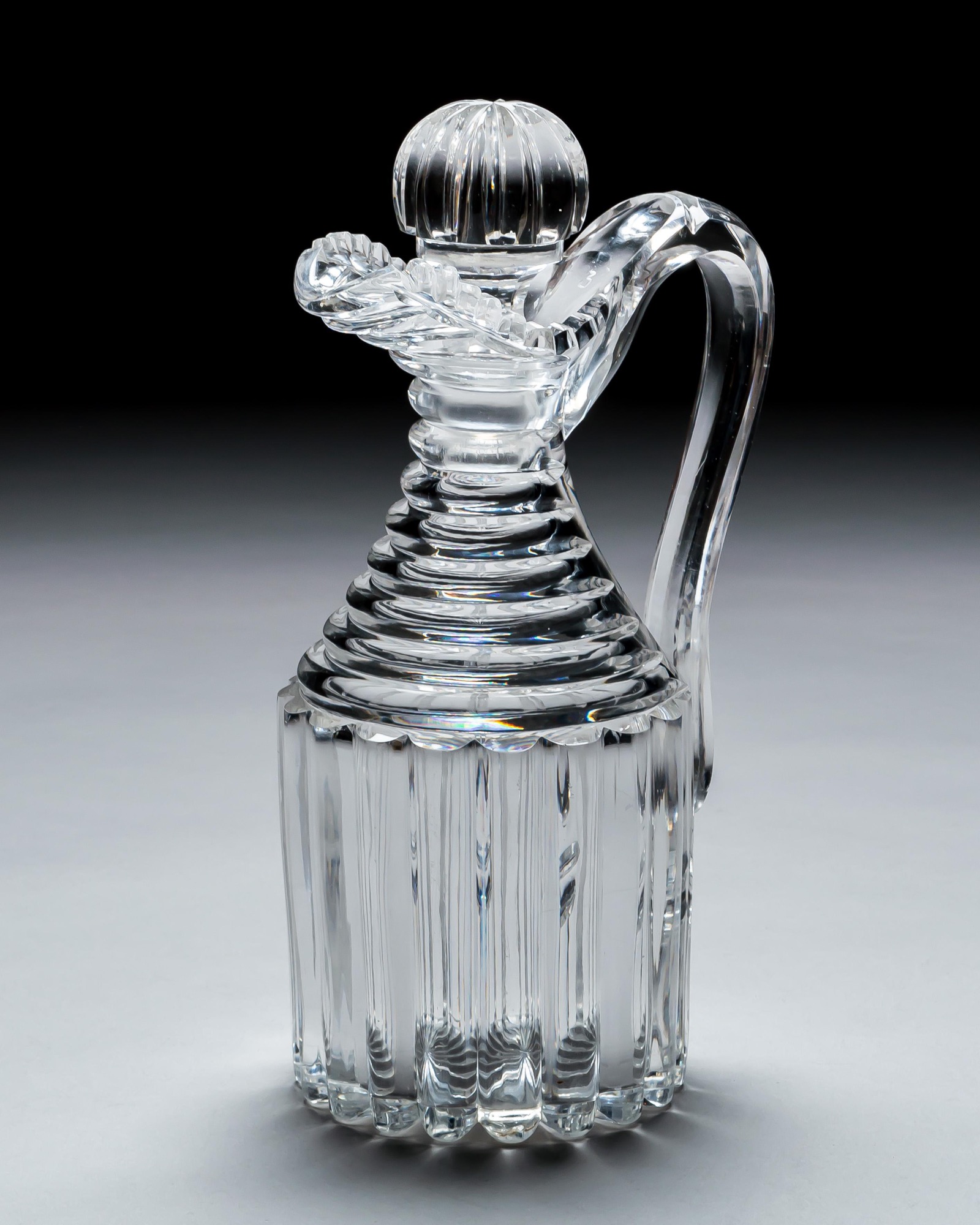 A PAIR OF PILLAR CUT REGENCY CLARET JUGS