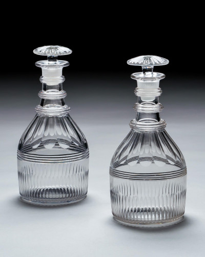 A PAIR OF REGENCY SLICE & FLUTE DECANTERS