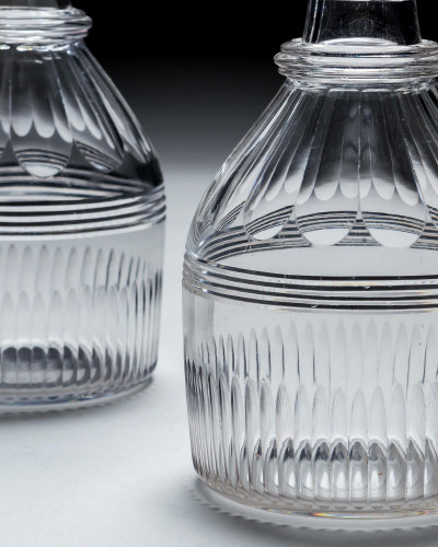 A PAIR OF REGENCY SLICE & FLUTE DECANTERS