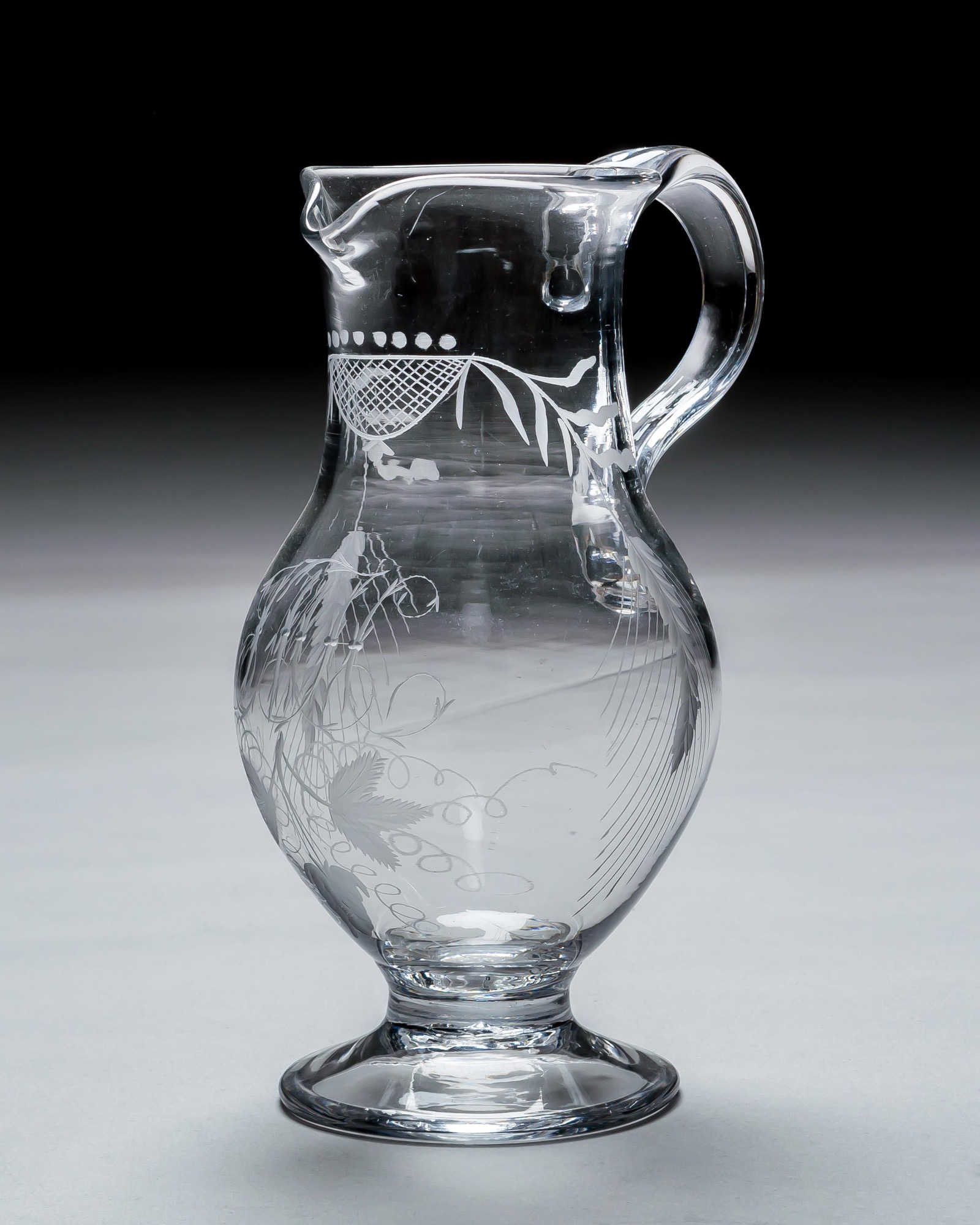 AN IRISH ENGRAVED GEORGIAN JUG