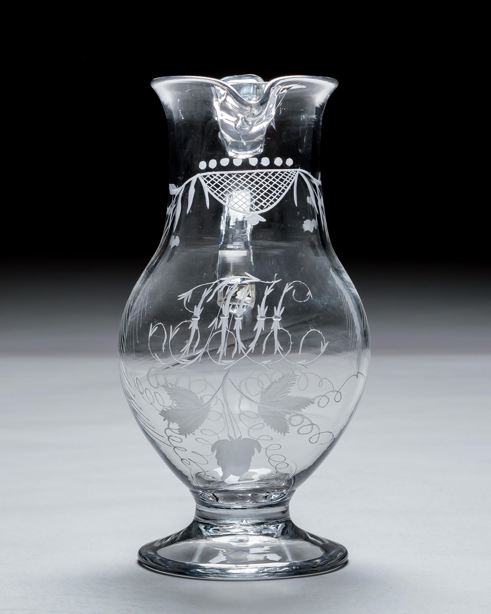 AN IRISH ENGRAVED GEORGIAN JUG