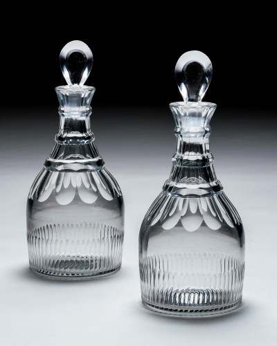 A PAIR OF SLICE & FLUTE DECANTERS