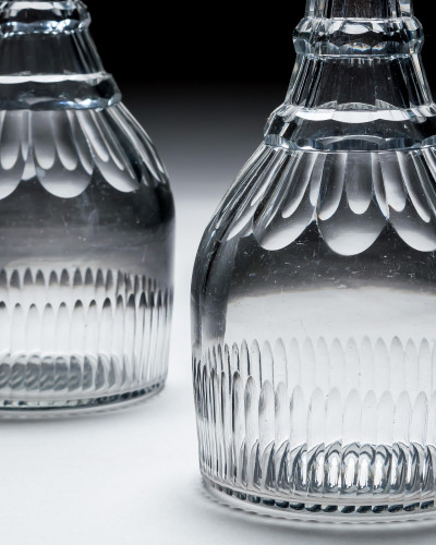 A PAIR OF SLICE & FLUTE DECANTERS