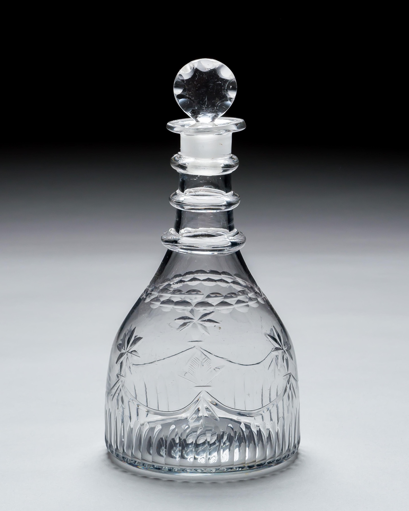 AN IRISH CUT GLASS DECANTER