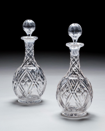 A PAIR OF HEAVILY CUT VICTORIAN DECANTERS