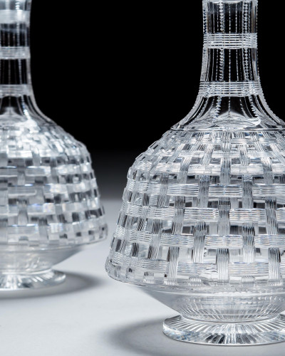 AN UNUSUAL PAIR OF VICTORIAN SPIRIT DECANTERS WITH BASKET WEAVE DECORATION