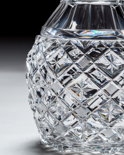 A HEAVILY CUT VICTORIAN DECANTER