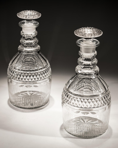 A PAIR OF SLICE & FLUTE CUT GEORGIAN DECANTERS WITH DIAMOND BAND