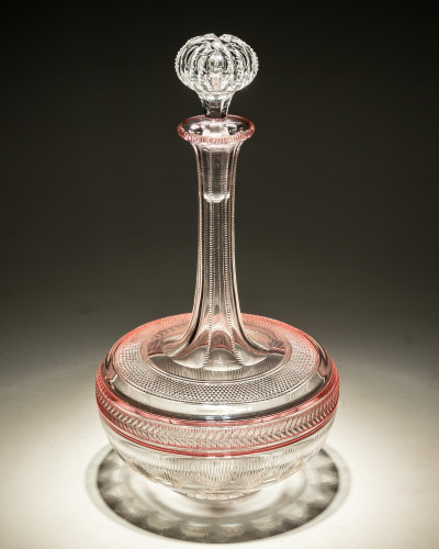 A FINELY CUT RUBY FLASHED SHAFT & GLOBE DECANTER