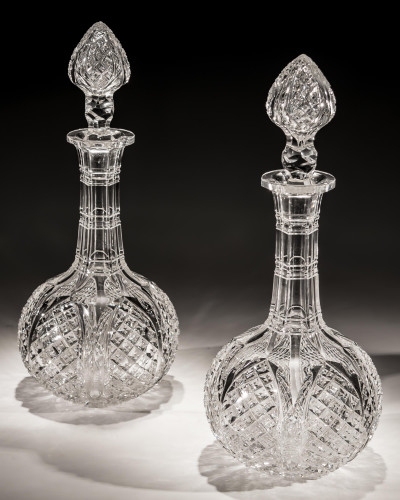 A PAIR OF VICTORIAN DECANTERS CUT WITH TULIP PETALS & CROSS OVER DIAMONDS