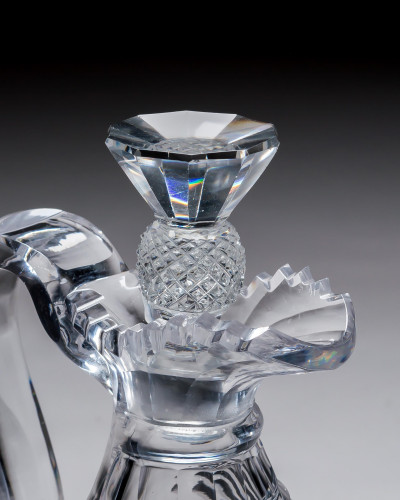 A HEAVILY CUT REGENCY CLARET JUG