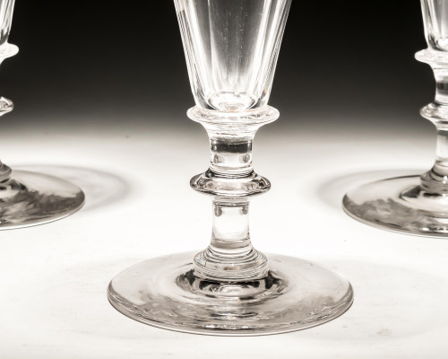 A SET OF THREE SLICE CUT CHAMPAGNE FLUTES