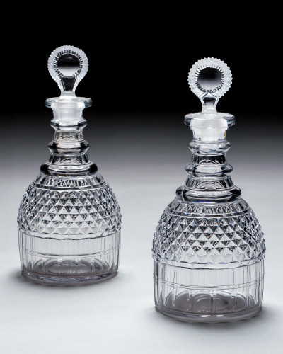 A PAIR OF REGENCY CUT GLASS DECANTERS