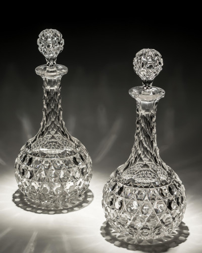 A PAIR OF ELABORATELY CUT VICTORIAN DECANTERS