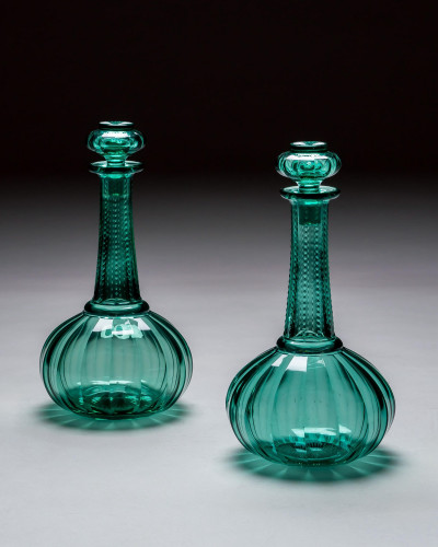 A PAIR OF GREEN SHAFT & GLOBE DECANTERS