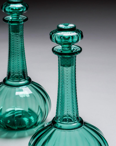 A PAIR OF GREEN SHAFT & GLOBE DECANTERS