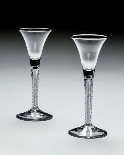 AN UNUSUAL PAIR OF MIXED TWIST WINE GLASSES
