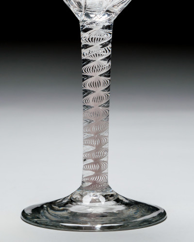A GENEROUS PANEL MOULDED OPAQUE TWIST WINE GLASS