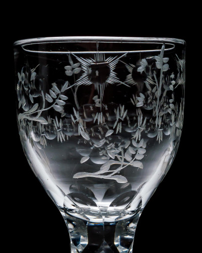 AN ELEGANT ENGRAVED FACET STEM WINE GLASS