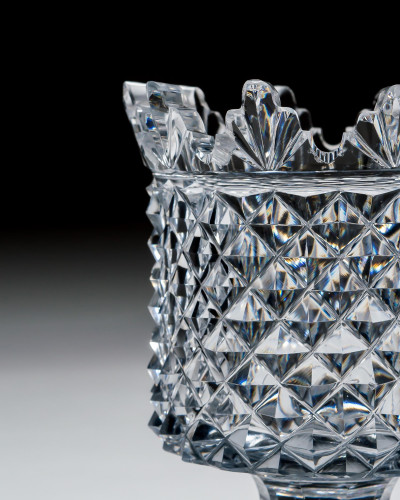 A REGENCY CUT GLASS PEDESTAL VASE