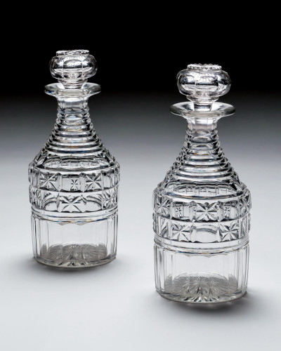 A RICHLY CUT PAIR OF WILLIAM IV CRYSTAL DECANTERS