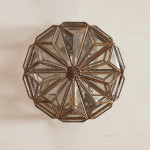 A pair of brass and glass wall lights by Taurus