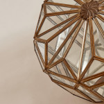 A pair of brass and glass wall lights by Taurus