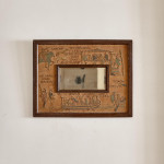 An unusual Arts & Crafts oak and embroidered mirror