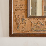 An unusual Arts & Crafts oak and embroidered mirror
