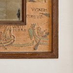 An unusual Arts & Crafts oak and embroidered mirror