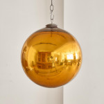 A Victorian amber glass witch's ball