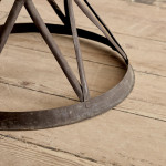 A riveted patinated metal garden chair