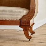 A fine Regency Amboyna sofa in the manner of George Bullock (1777 - 1818)