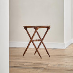 A Victorian walnut folding bobbin table