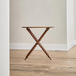 A Victorian walnut folding bobbin table
