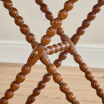 A Victorian walnut folding bobbin table
